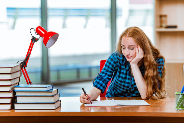 Young Female Student Preparing Exams